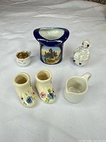 Group shot of six miniature porcelain pieces