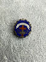 Front view showing enamel design and lettering