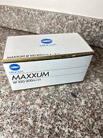 Minolta branded box showing model AF 100-300 f/4.5-5.6