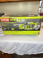 Retail box displaying Ryobi ONE+ 18V 4-piece combo kit contents