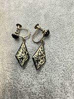 Front view showing diamond drops and floral design