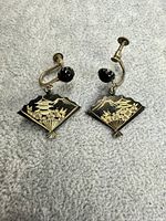 Pair of fan-shaped earrings front view