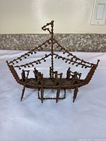 Full view of handmade clove model boat showing overall form and structure