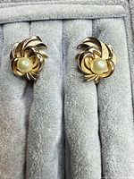 Frontal view of both earrings showing overall design and faux pearl centers