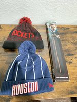 Full lot showing two beanies and boxed wand