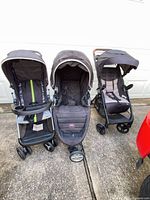 Three strollers side by side showing overall condition and design