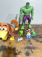 Group shot showing Slinky Dog, large Hulk, and four small figures
