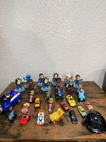 Full lot overview showing figures, vehicles and mask