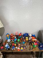 Full lot overview on table showing all small action figures