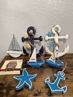Group shot of all nautical wood décor items and photo frame