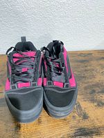 Front view of both shoes showing uppers, laces, and toe structure