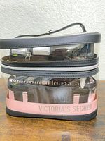 Large clear PVC travel case containing inner pouches