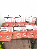 All six packs of Wanda textured sheer grommet curtains displayed