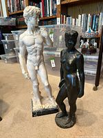 Front view of both sculptures showing scale and detail