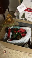 Box with artificial greenery, ornaments and wooden bear piece