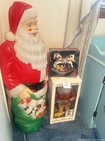 Blow-mold Santa with boxed accessories