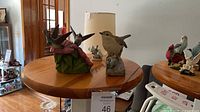 Group on pedestal showing hummingbird piece and wren figurine