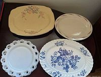 Group view of four of the platters showing patterns and shapes