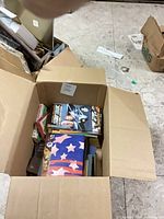 Open carton showing assorted paperbacks