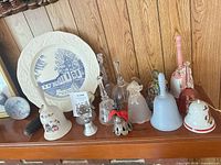 Full lot showing plate and bells on mantle