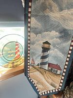 Tapestry runner and round lighthouse plate