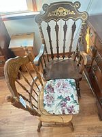 Both chairs together showing styles, finish and cushion