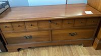 Front view showing drawers, lock and missing knob