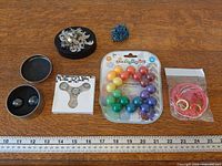 All items arranged beside ruler for scale