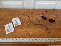 All items laid out with ruler for scale