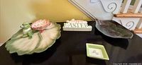 Overall lot showing lily-pad frog platter, Easter sign, leaf tray and square 'Pray' dish