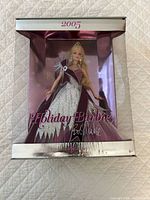 Front of boxed 2005 Holiday Barbie showing doll and reflective packaging