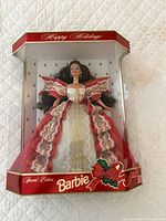 Front view of boxed 1997 Happy Holidays Barbie showing gown detail and clear window