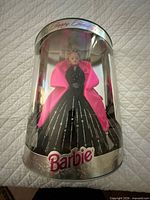 Front view of Barbie in original cylindrical box