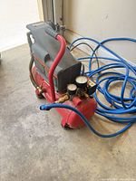 Full view of Craftsman compressor with blue hose