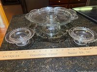 Top view of cake stand and two compotes with ruler for scale