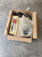 Full box view showing assorted boxed locomotives, freight car, track and accessories