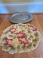 Front view of both platters showing designs and relative sizes