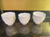 Three stacks of the Lenox bowls showing quantity and pattern