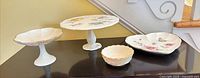 All four Lenox porcelain pieces displayed together