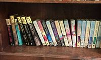 Shelf view showing Danielle Steel and other books left side