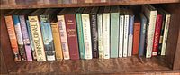 Full shelf showing majority of hardcover novels
