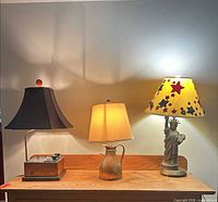 All three lamps side by side showing overall design and included shades