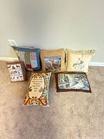Group shot of six rectangular pillows showing fronts and variety of designs