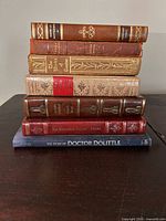 Spine view of all seven books stacked
