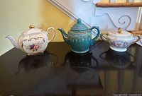 All three porcelain pieces on display