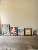 All six wall art pieces lined up on floor