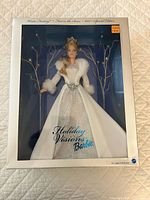 Front of sealed box showing doll and Holiday Visions branding