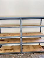 Front view of full shelving unit showing five tiers and overall condition