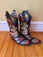 Front angled view of both boots displaying color pattern and overall condition