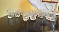 Twelve crystal tumblers displayed on tabletop (only eight included as per lot)